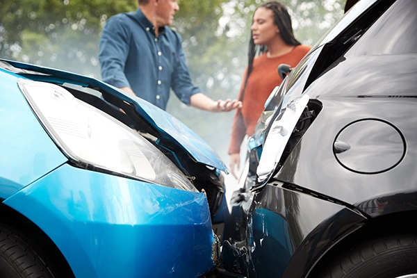 People talking at the scene of an auto accident