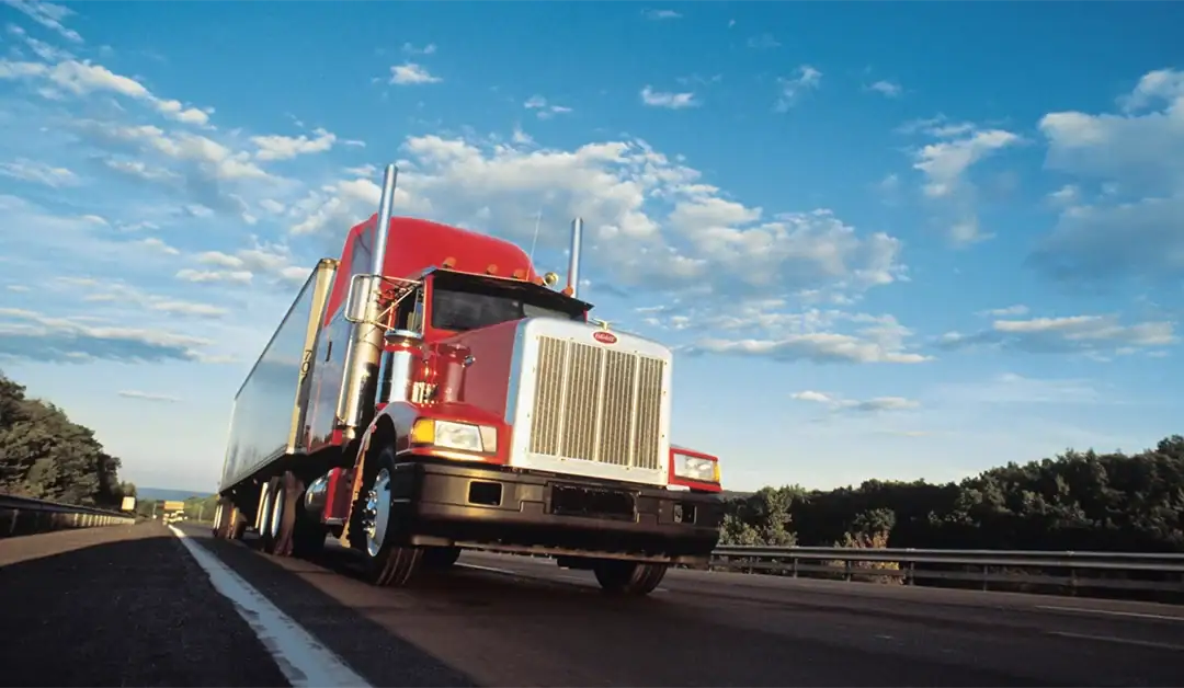 Red semi truck on the highway